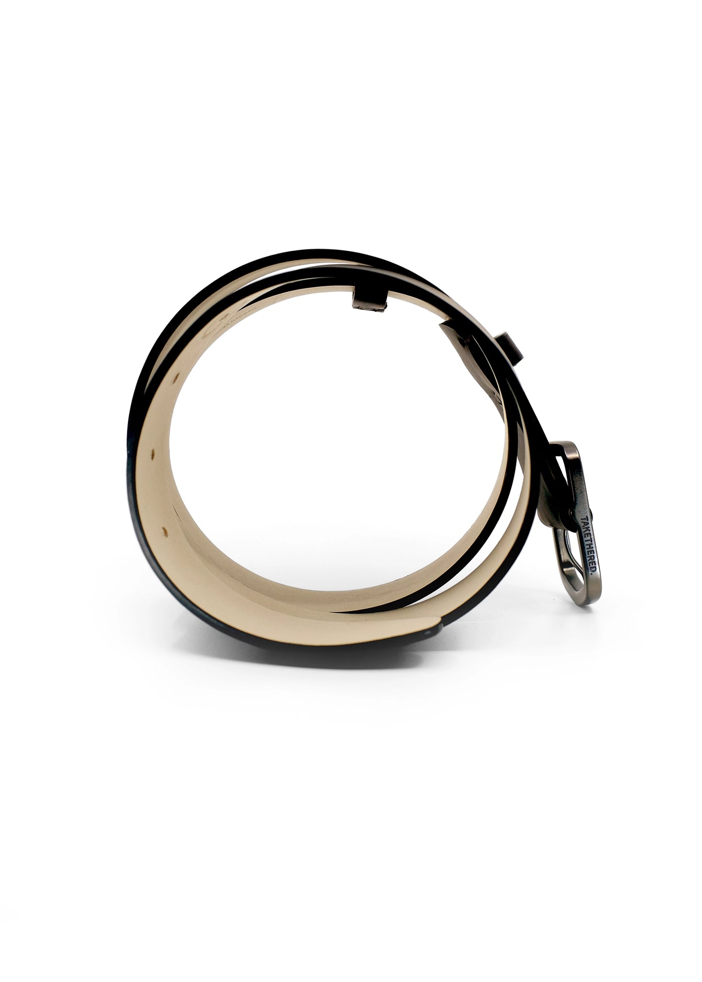 Side view of coiled Classic Espresso smooth leather belt with a gunmetal buckle and "TAKETHERED." engraving.