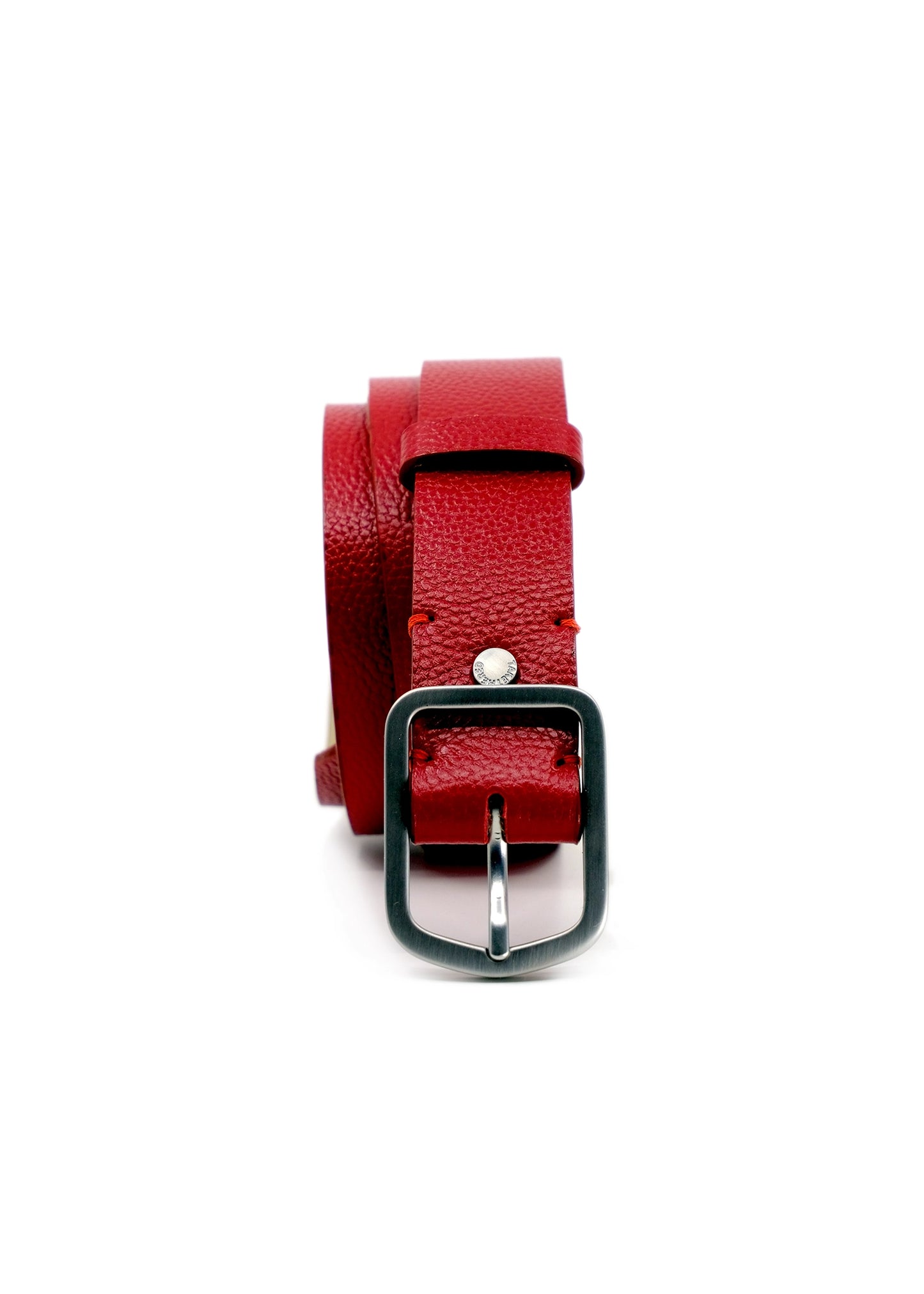 Vertical profile of coiled Blood Simple Grunge Belt in deep red pebble-grain leather with a weathered silver buckle.
