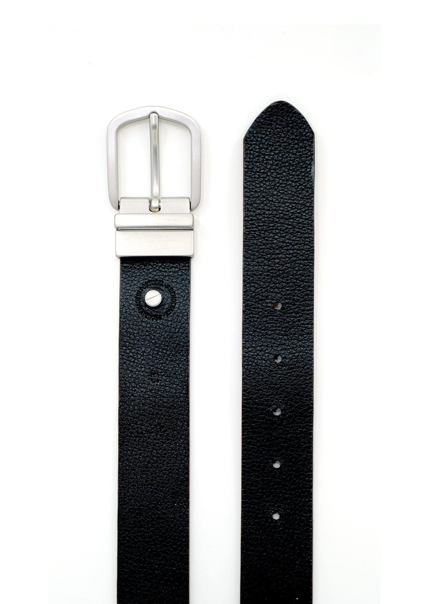 Top-down view of Two-Face Belt showing the pitch black grain leather side with a reversible silver buckle.