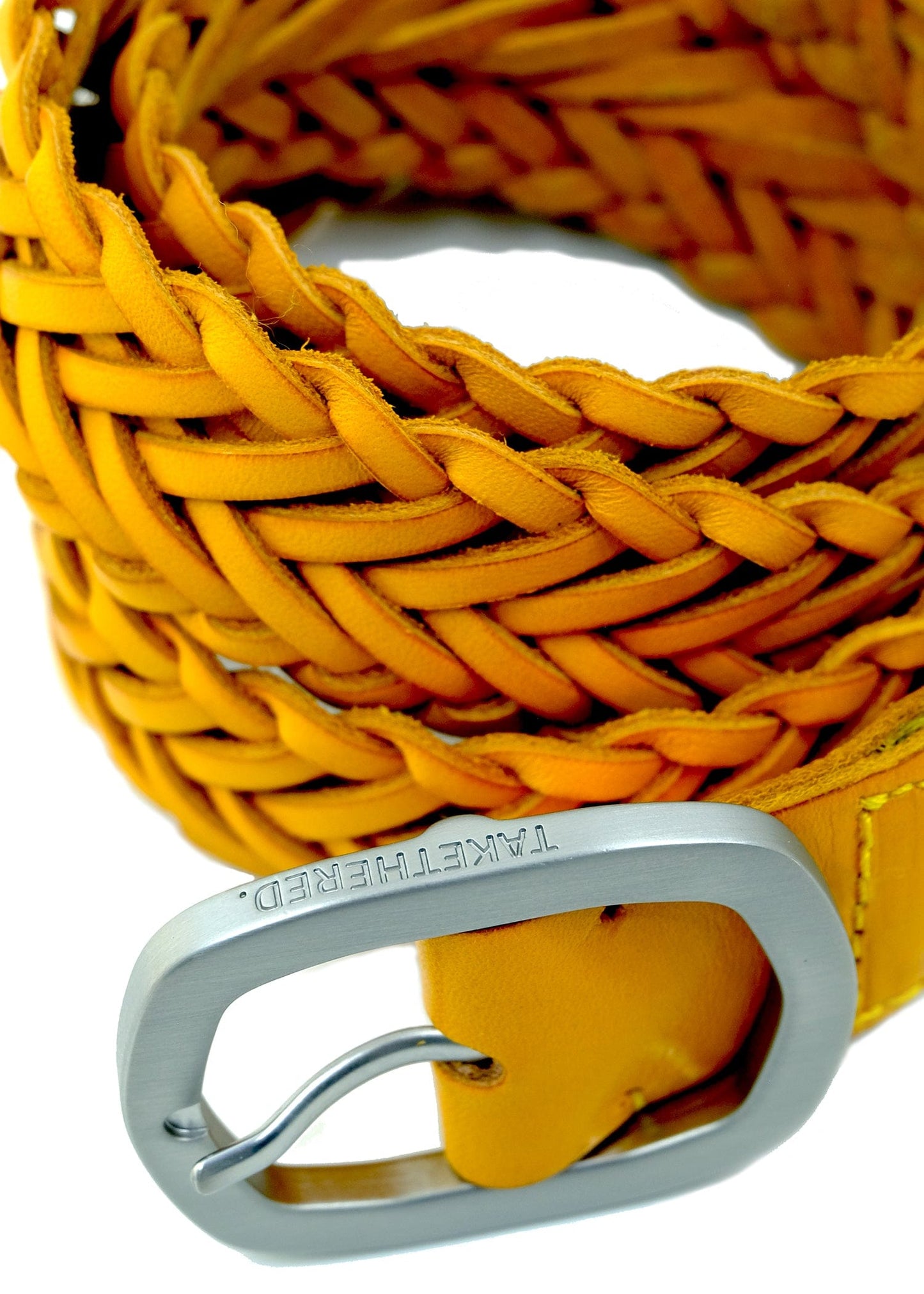 Macro shot of Submarine Yellow braided belt with a matte silver buckle featuring an engraved "TAKETHERED." logo.