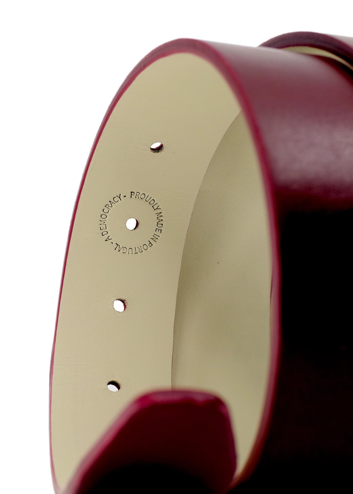 Interior view of Red Mist belt with "Proudly Made in Portugal" stamp on cream leather lining.