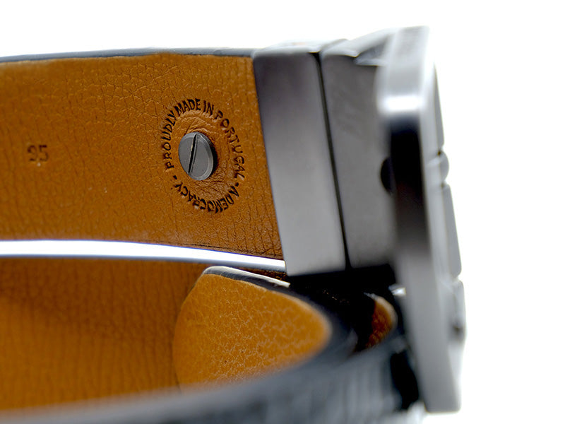 Extreme close-up of the inside details of a Two-Face belt with text proudly made in Portugal, a democracy.