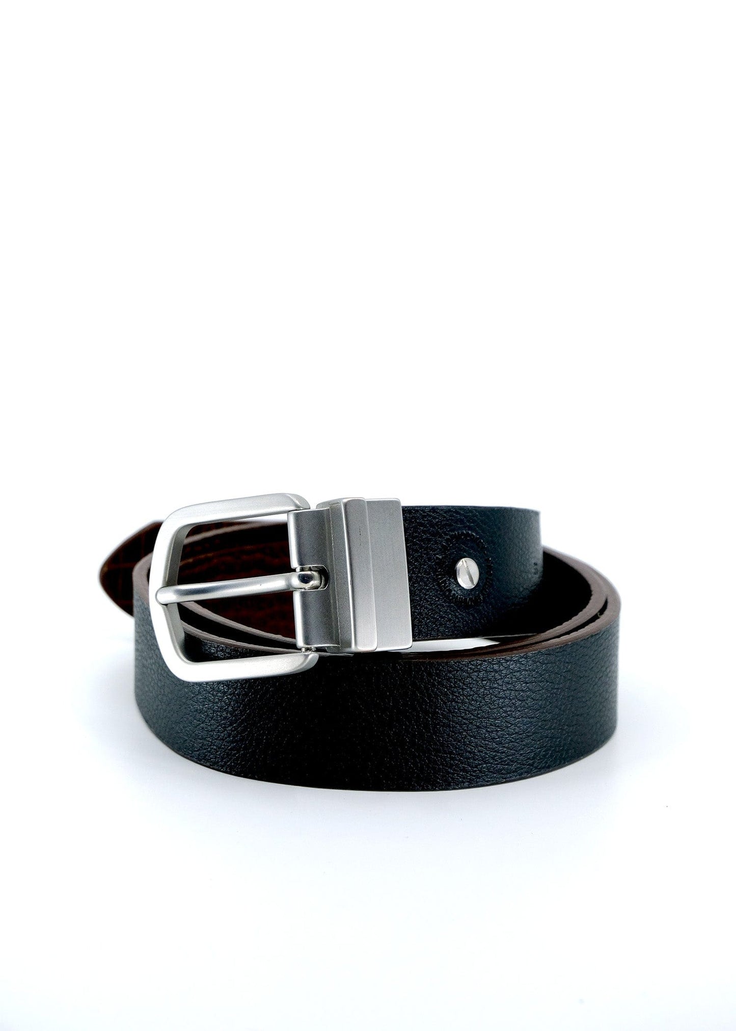 Coiled Two-Face Belt showing the pitch black leather side with a reversible brushed silver buckle.