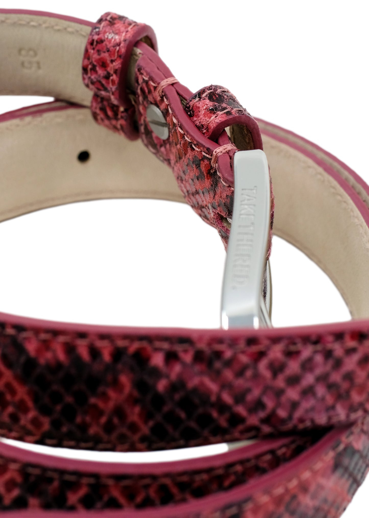 Side-angle macro of the Barbie Pink snakeskin belt, showing the silver buckle and the smooth interior lining.