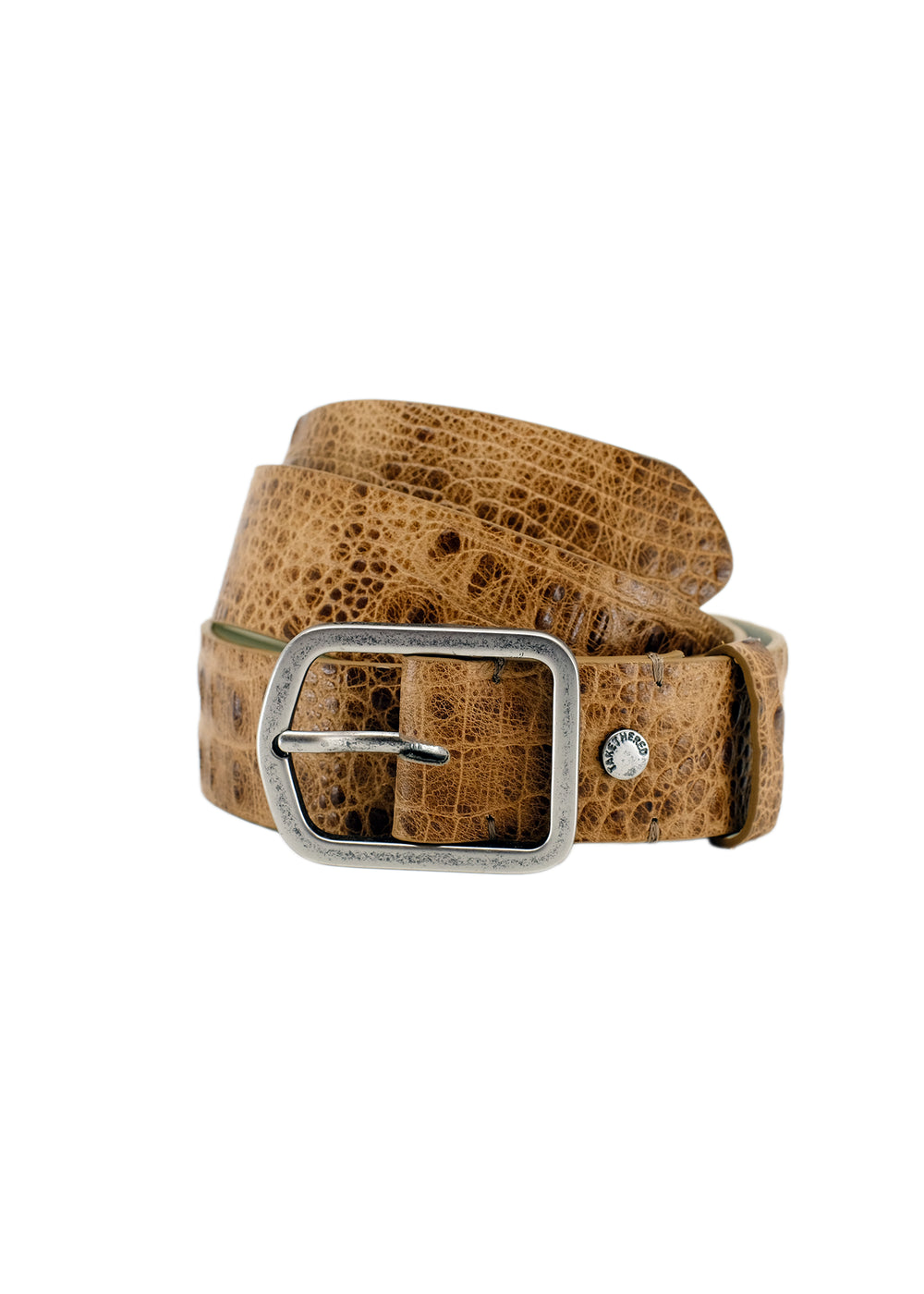 Coiled tan crocodile embossed leather belt with a silver buckle, isolated on a white background.
