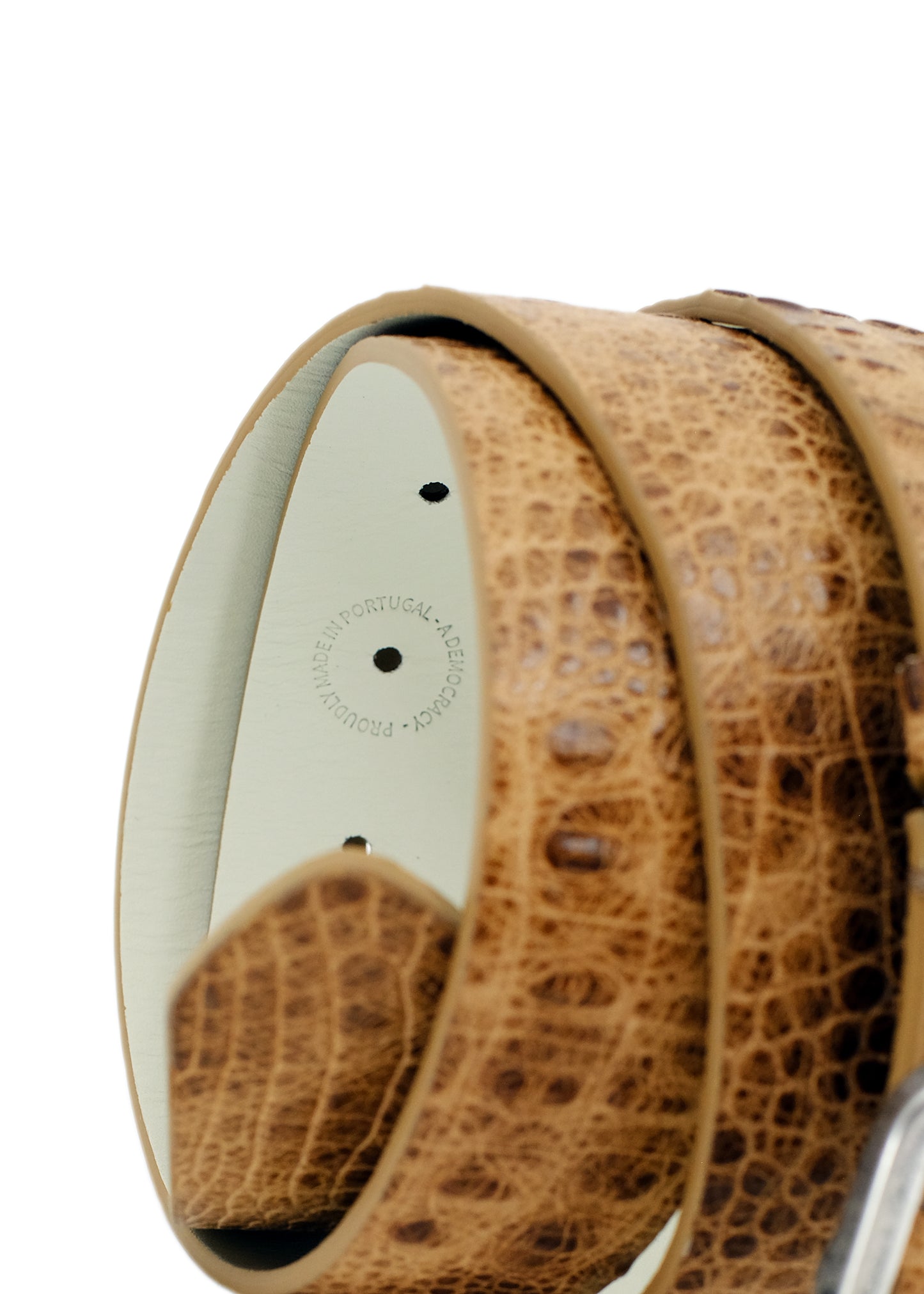 Macro shot of the Dusty Spring belt's interior, showing the stamp and the contrast between the crocodile exterior and smooth cream lining.