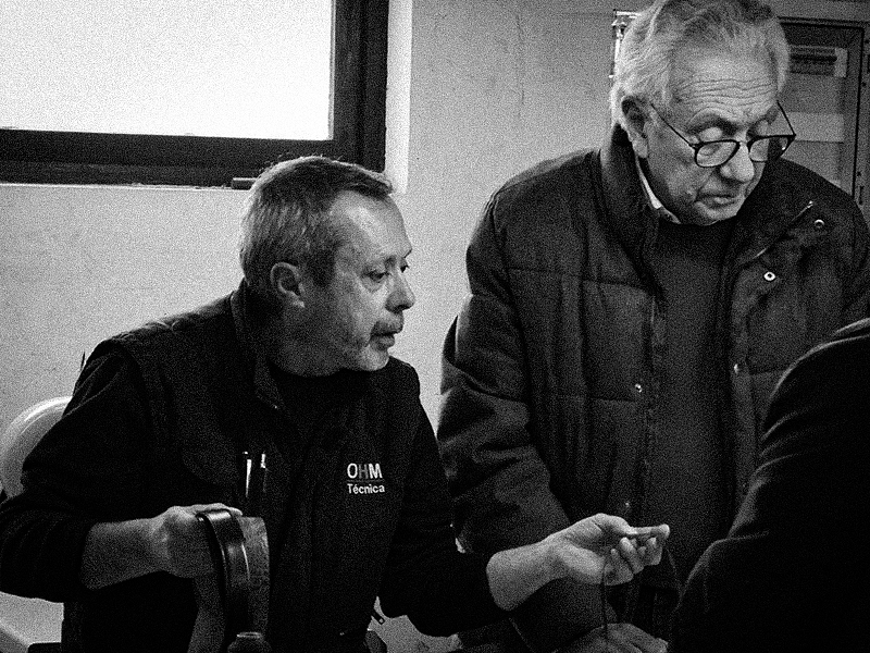 Artisanal craftsmen discuss the making of leather belts in Porto.